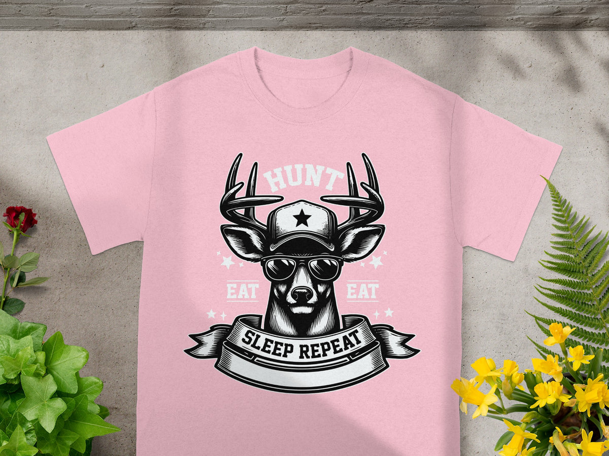 Pink t-shirt with buck wearing sunglasses and hat, text "Hunt Eat Sleep Repeat".