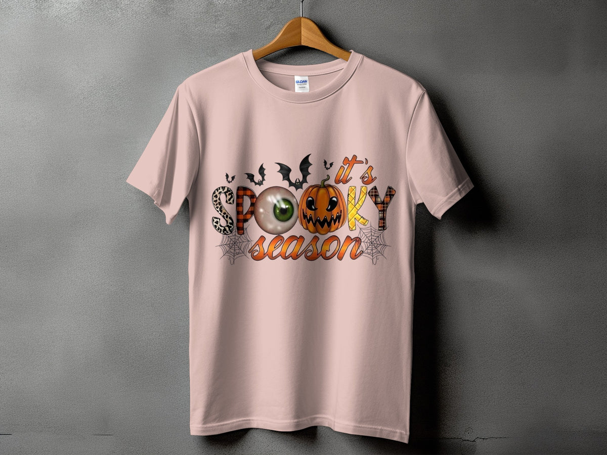 Pink t-shirt with "It's Spooky Season" text and Halloween graphics.