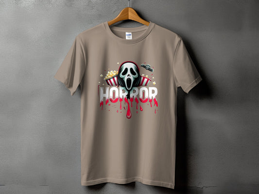 T-shirt with horror mask, popcorn, and dripping red text.