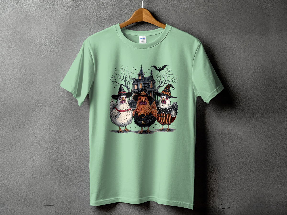 Three chickens in Halloween costumes stand before a spooky house with bats.
