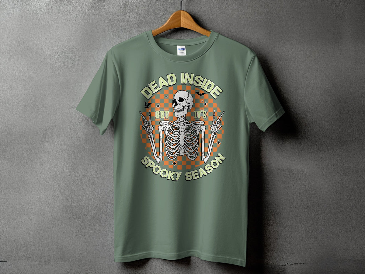 Green t-shirt with skeleton graphic saying "Dead Inside But It's Spooky Season"