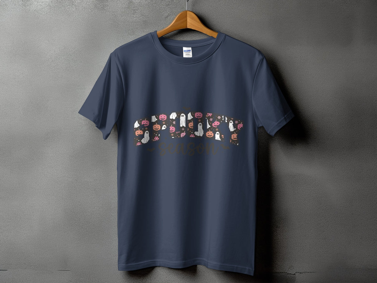 Dark blue t-shirt with Halloween-themed ghosts, pumpkins, and flowers, and text "spooky season."