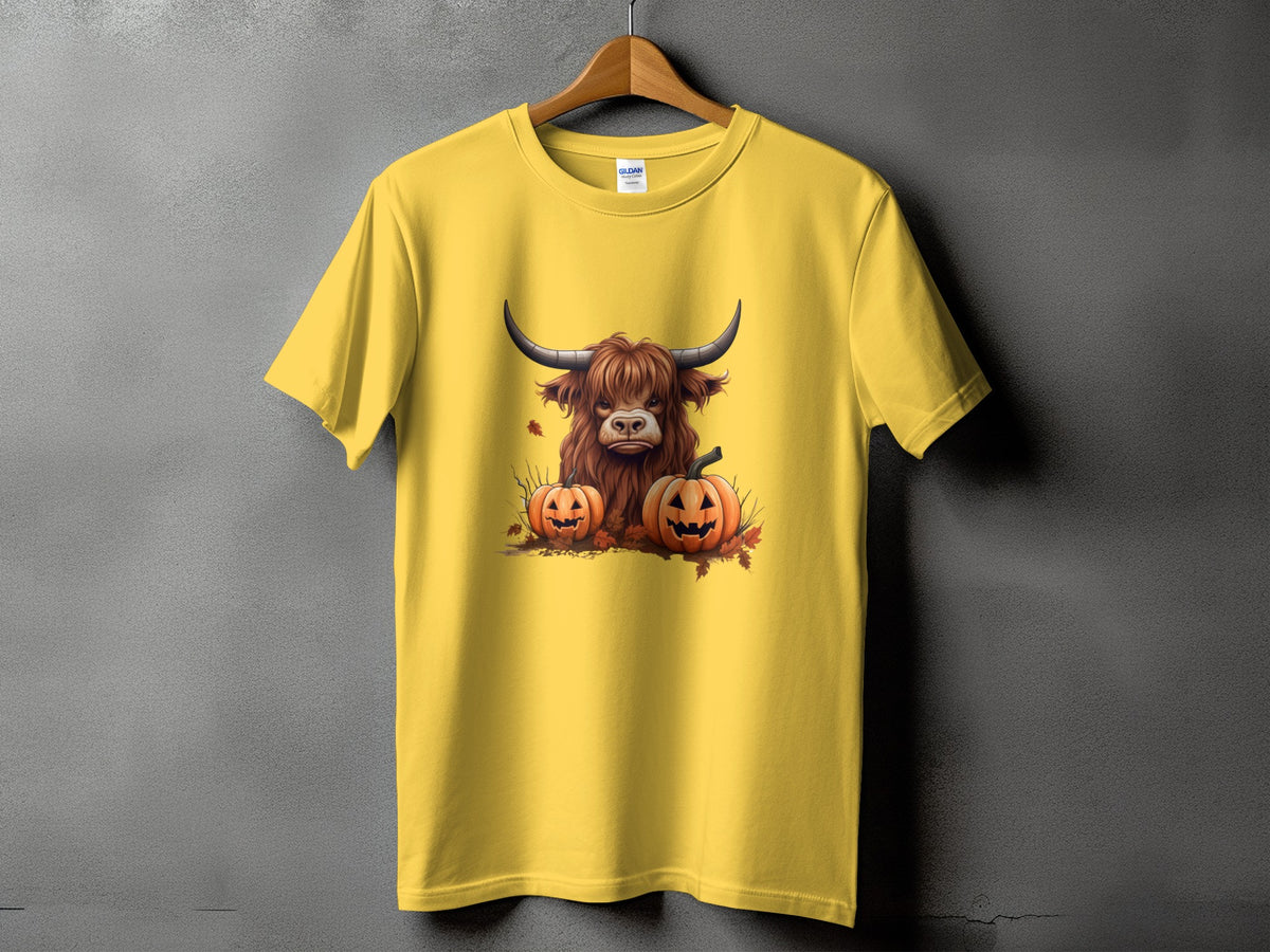 Yellow t-shirt with Highland cow and pumpkins Halloween graphic.