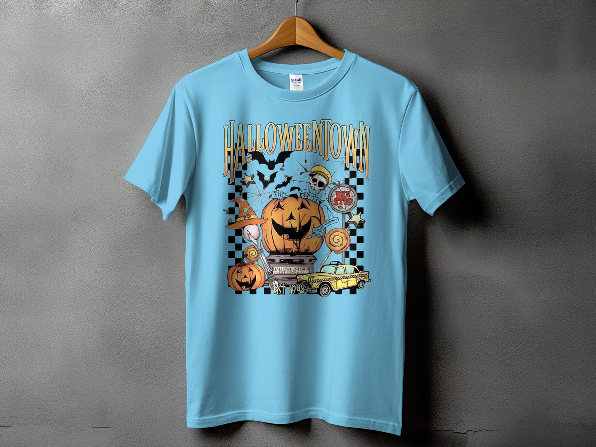 Light blue t-shirt with Halloween graphic featuring pumpkins, skeletons, bats, and the text "HALLOWEENTOWN EST 1998".